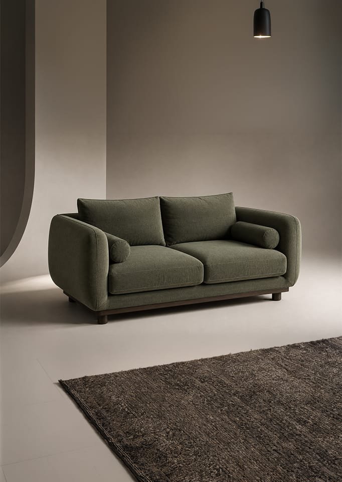 Modern green loveseat with cushions in minimalist interior by Realistic 3D